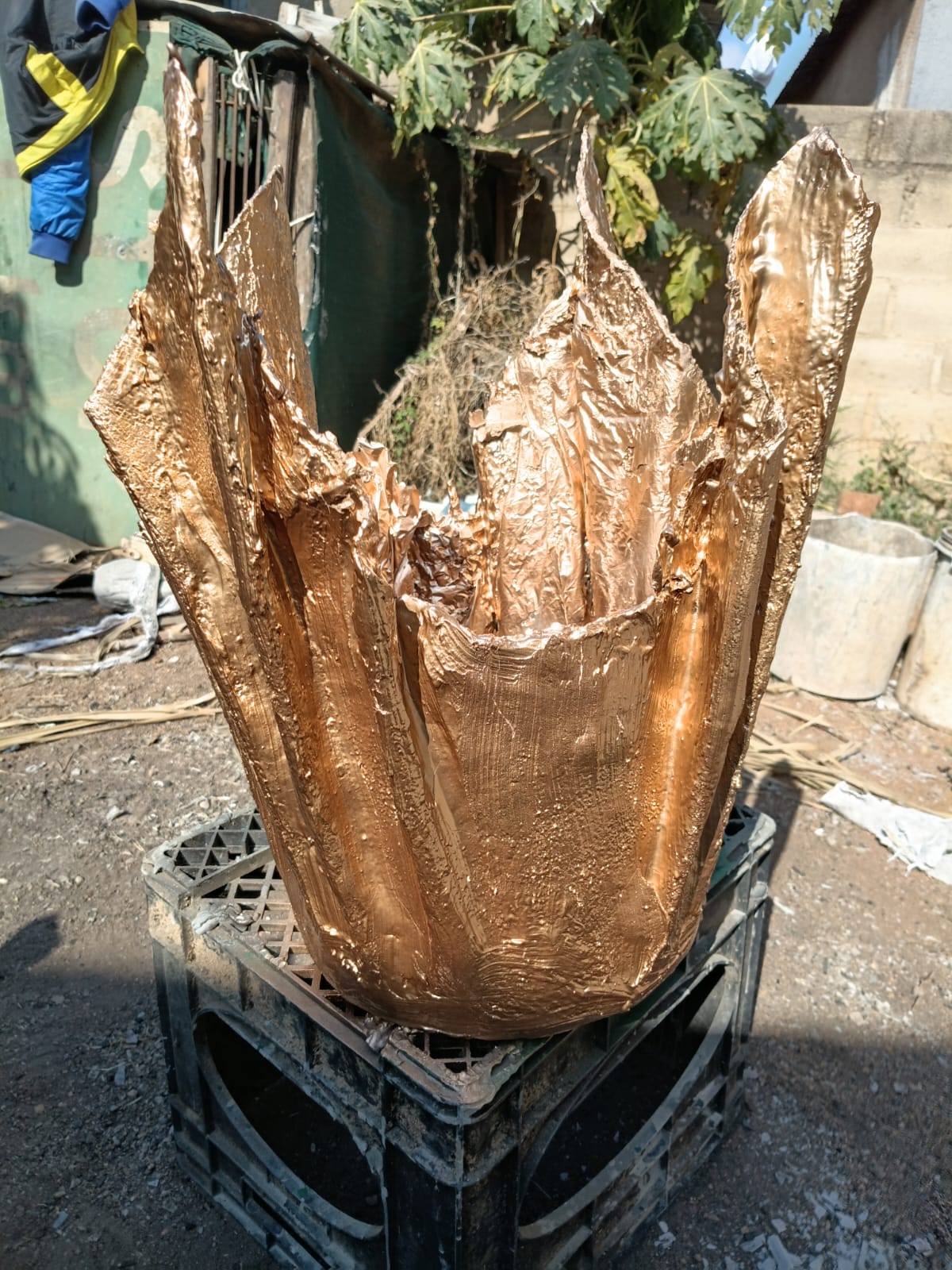 Silver and gold foil flower pot in progress in the workshop